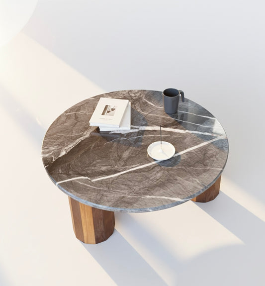 Handmade iO-v1 Round Coffee Table by Redline Design with a natural stone top resting on three solid wood columns carved as dodecahedrons